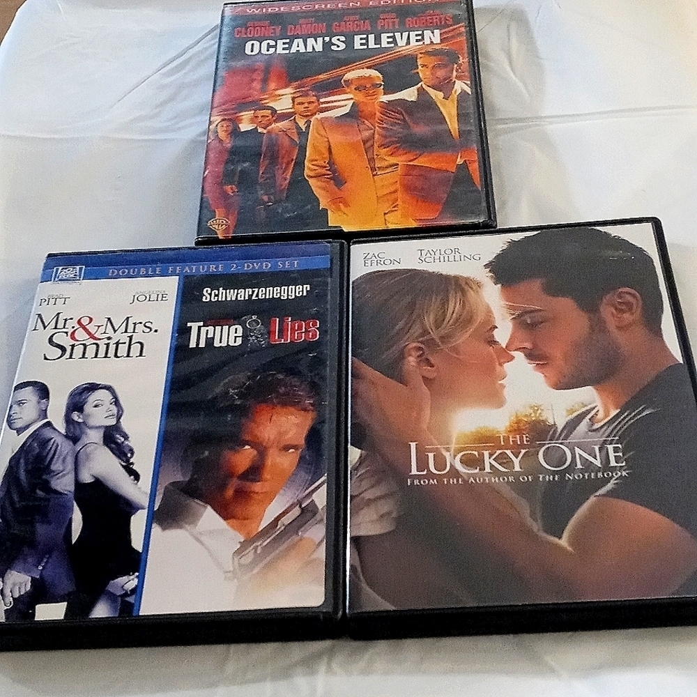 4 DVD s The lucky one, Mr&Mrs Smith, True Lies, Ocean's eleven 4 movies